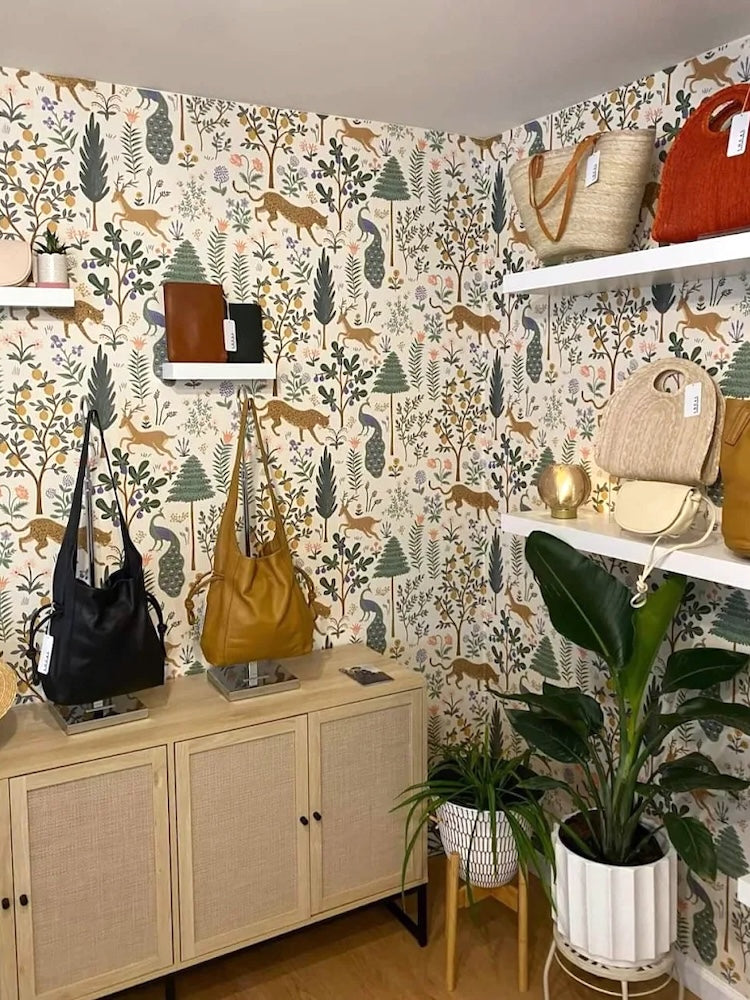 Artisan leather handbags and straw totes at women's clothing store Local Assortment in Beacon, NY.