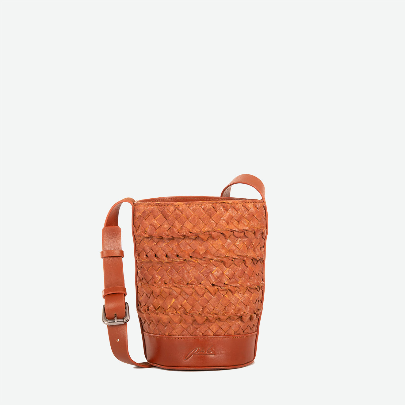 Mini chestnut brown woven leather crossbody bucket with compact shape and adjustable leather strap.