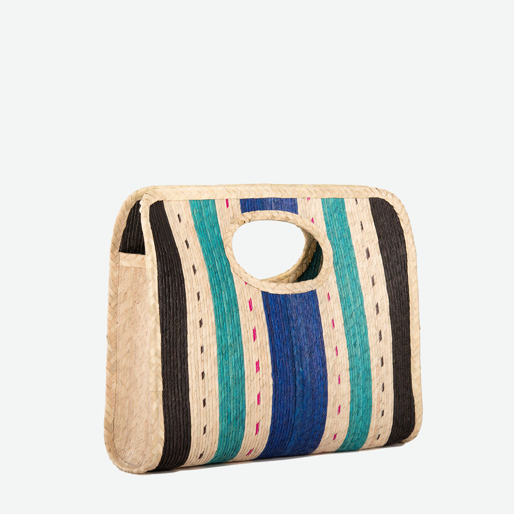 
                  
                    A square straw beach tote with vertical blue, black and turquoise stripes - image 2
                  
                