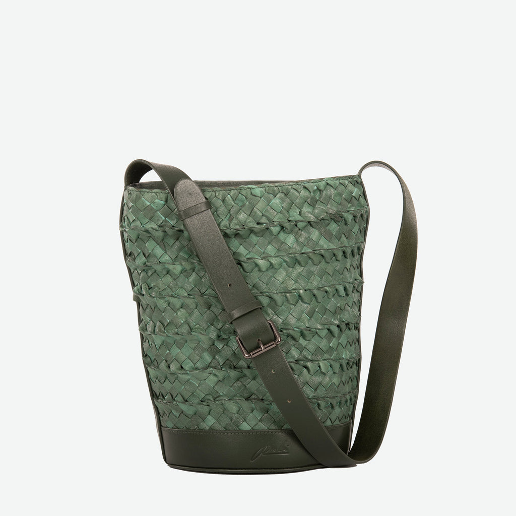 A pine green woven leather bucket bag  with an adjustable shoulder strap - image 1
