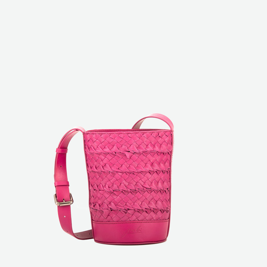 A mini small orchid pink woven leather bucket bag  with an adjustable crossbody strap - image 1