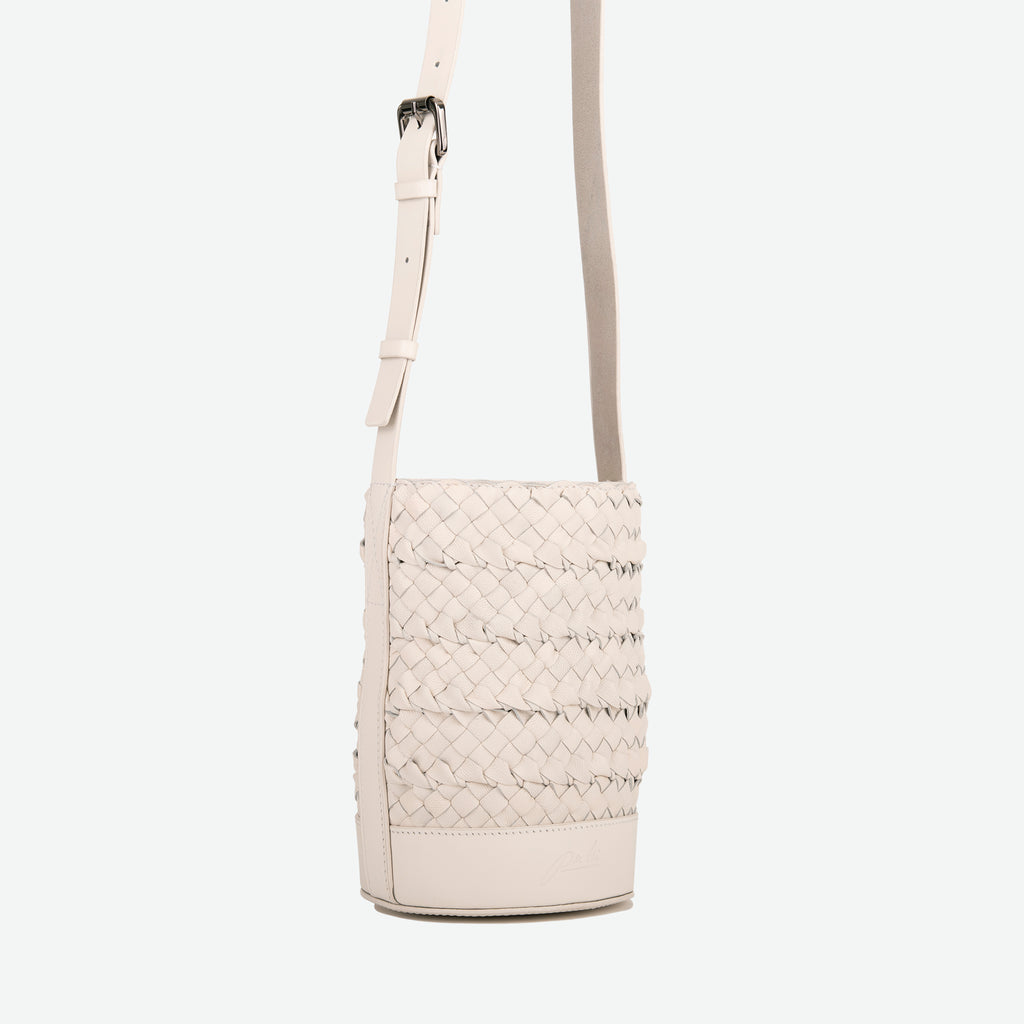 A mini small stone white woven leather bucket bag  with an adjustable crossbody strap - image 2