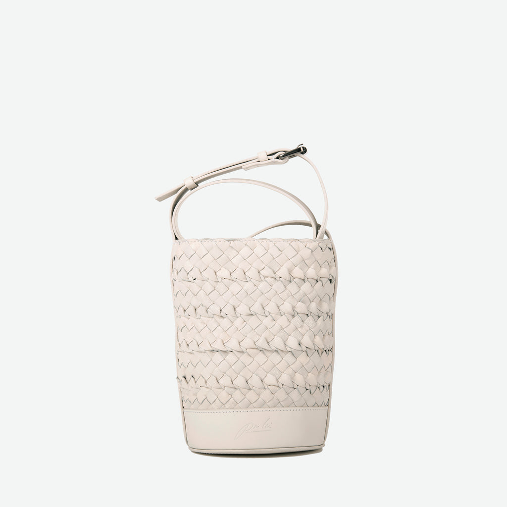 A mini small stone white woven leather bucket bag  with an adjustable crossbody strap - image 5
